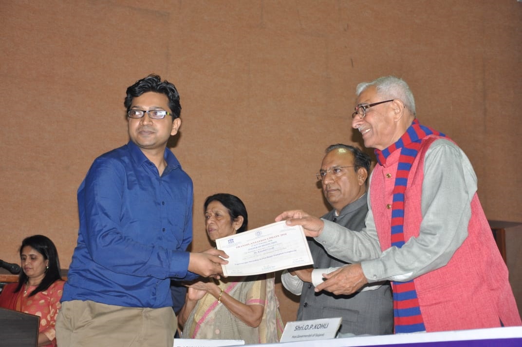 Dr. Kaushal Goyal receiving an award at a medical event